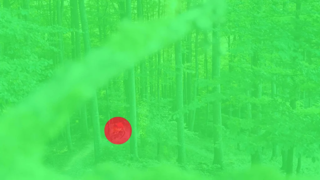 Eine grüne Flüche mit einem roten Punkt, um Farbkontraste zu verdeutlichen.